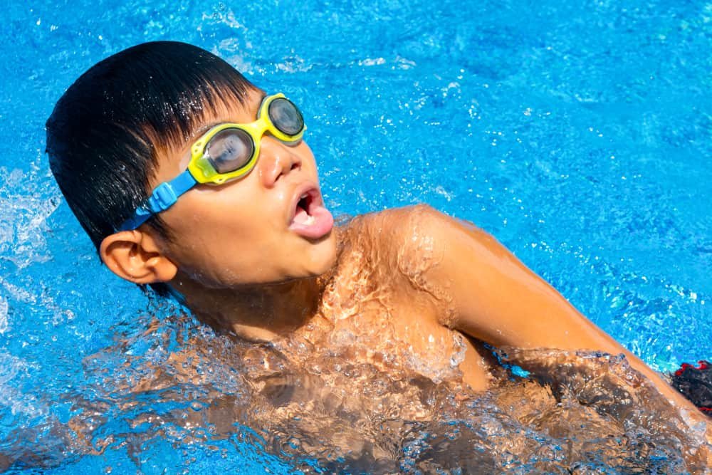 Boy swimming and breathing