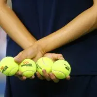 Ball boy holding tennis balls at the Billie Jean King National Tennis Center