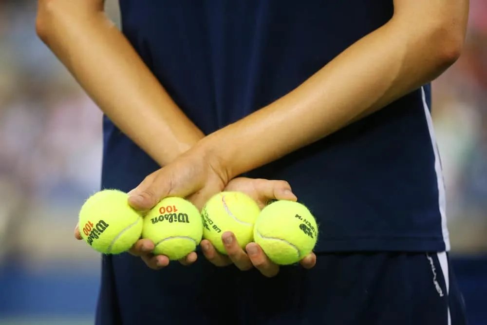 Ball boy holding tennis balls at the Billie Jean King National Tennis Center