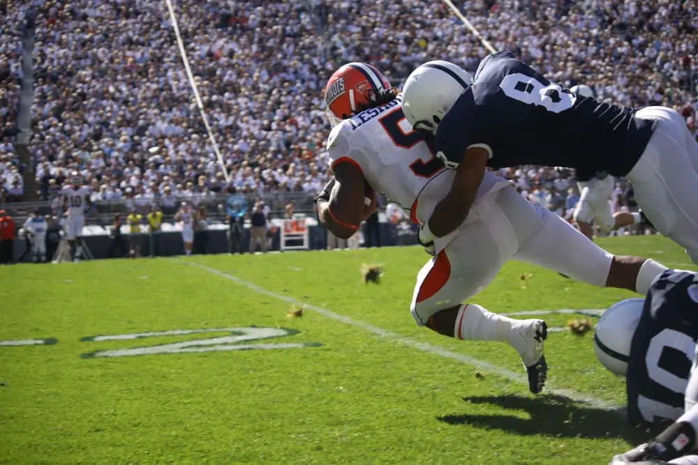 Illinois running back No. 5 Mikel Leshoure is tackled after a long gain during a football game