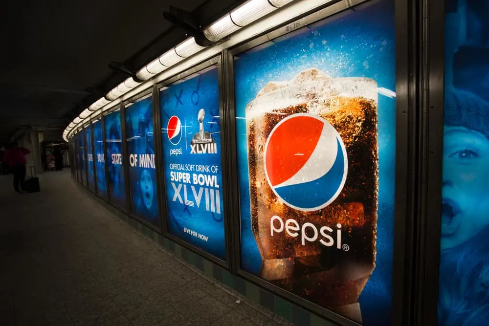 Pepsi Cola Super Bowl advertisements in Times Square NYC subway station football