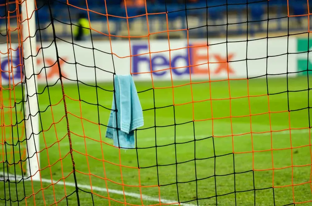 The goalkeeper's towel hangs on the goal net player during the UEFA Europa