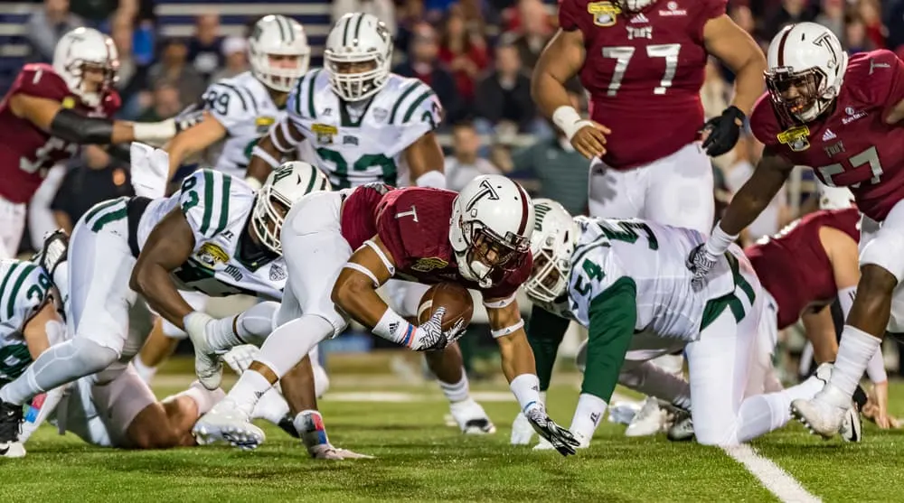 Troy University #26 B.J. Smith recovers his own fumble after a kick-off from the Ohio Bobcats