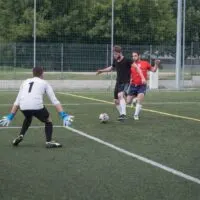goal keeper trying to parry the ball in a soccer tryouts