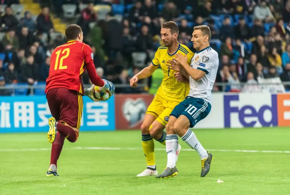 soccer goalkeeper Dmytro Nepohodov, defender Serhiy Malyi and Russia striker Fedor Chalov
