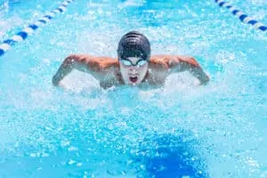 swimmer swimming butterfly stroke in a race