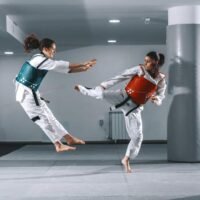 women sparring in taekwondo
